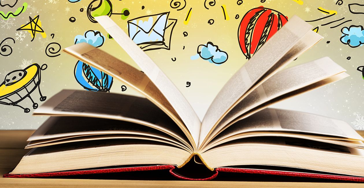 A red book opened.  Colorful background with pictures of cartoon sun, clouds, stars, space ship and planets